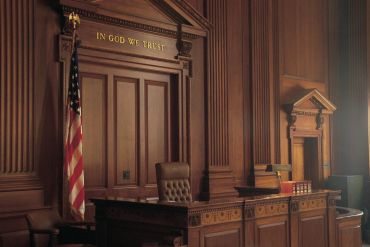 Courtroom interior with American flag.